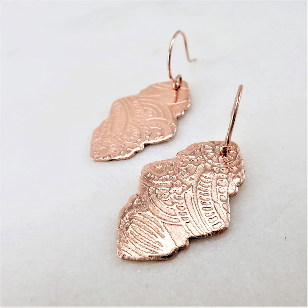 Textured rose gold dangle earrings with French ear wires.