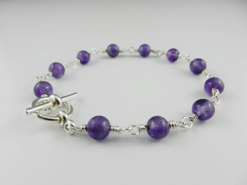 amethyst, amethyst bracelet, amethyst and silver bracelet, silver bracelet, sterling silver bracelet, amethyst and silver bracelet, amethyst and sterling silver bracelet, artisan bracelet, artisan silver bracelet, artisan sterling silver bracelet, toggle clasp, sterling silver toggle clasp, silver toggle clasp, sterling silver jewelry, silver jewelry, wire wrapped silver, wire wrapped sterling silver, round square beads, purple beads
