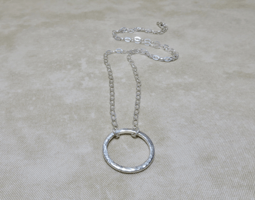 silver necklace, sterling silver necklace, sterling necklace, slender necklace, circle necklace, silver chain necklace, layering necklace, layering jewelry, everyday necklace, hammered silver necklace, Silver Echoes, minimalist necklace, minimalist jewelry, modern necklace, modern jewelry, simple necklace, simple jewelry, everyday necklace, everyday jewelry, spiritual necklace, spiritual jewelry, elegant necklace, Zen necklace, Zen jewelry, energy necklace, energy jewelry, Reiki necklace, Reiki jewelry, healing necklace, healing jewelry, chakra jewelry, chakra necklace, power jewelry, power necklace, handmade necklace, handmade jewelry, handcrafted necklace, handcrafted jewelry, artisan necklace, artisan jewelry, wedding necklace, wedding jewelry, bridesmaid necklace, bridesmaid jewelry, bridal necklace, bridal jewelry, New Year’s gift, Valentines gift, birthday gift, Mother’s Day gift, anniversary gift, Christmas gift, gifts for her, Kwanza gift, Hanukah gift, mother of the bride necklace, mother of the bride jewelry