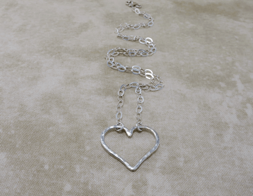 heart shaped necklace, heart necklace, silver necklace, sterling silver necklace, sterling necklace, slender necklace, silver chain necklace, layering necklace, layering jewelry, everyday necklace, hammered silver necklace, Silver Echoes, sweetheart necklace, minimalist necklace, minimalist jewelry, modern necklace, modern jewelry, simple necklace, everyday necklace, everyday jewelry, spiritual necklace, spiritual jewelry, elegant necklace, Zen necklace, Zen jewelry, energy necklace, energy jewelry, Reiki necklace, Reiki jewelry, healing necklace, healing jewelry, chakra jewelry, chakra necklace, power jewelry, power necklace, handmade necklace, handmade jewelry, handcrafted necklace, handcrafted jewelry, artisan necklace, artisan jewelry, wedding necklace, wedding jewelry, bridesmaid necklace, bridesmaid jewelry, bridal necklace, bridal jewelry, New Year’s gift, Valentines gift, birthday gift, Mother’s Day gift, anniversary gift, Christmas gift, gifts for her, Kwanza gift, Hanukah gift, mother of the bride necklace, mother of the bride jewelry