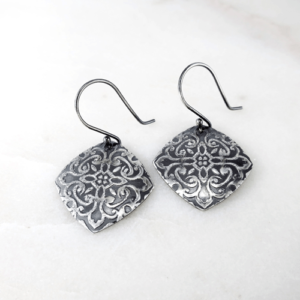 Sterling silver square elegance earrings with intricate embossed detailing, adding a touch of elegance to any outfit.