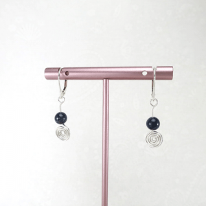 Sterling silver spiral earrings with sapphire gemstone and lever back ear wires.