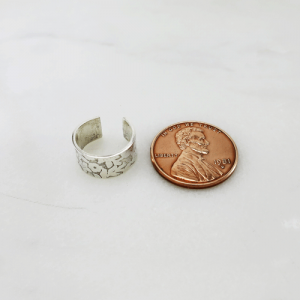 Sterling silver ear cuff showcasing modern elegance and minimalist design.