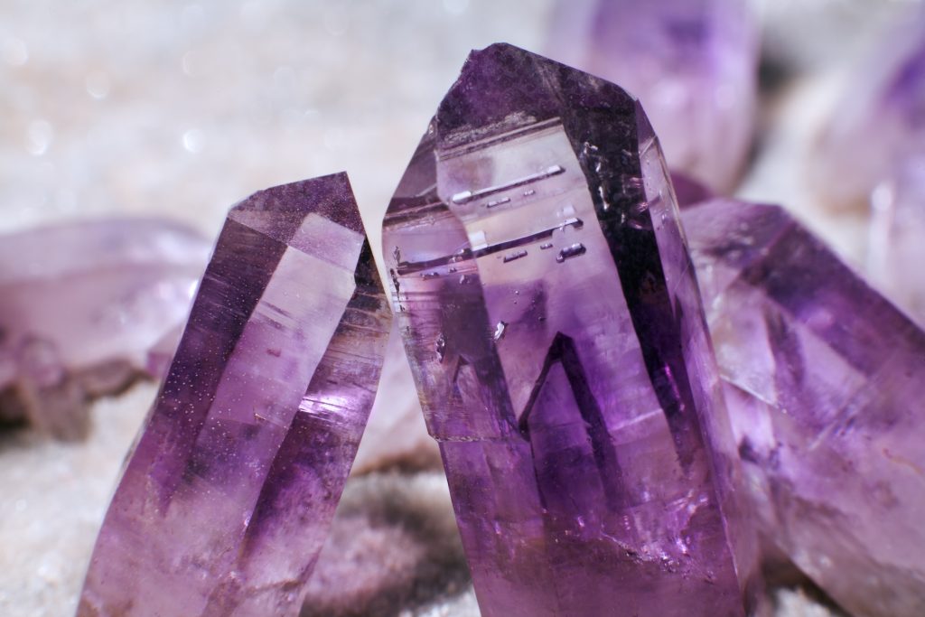 Vibrant amethyst gemstones, February's birthstone, showcasing their rich purple hues.