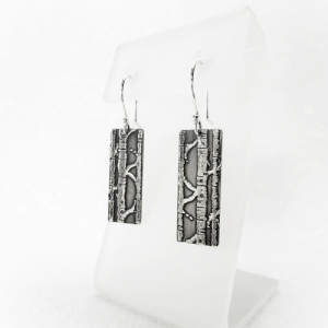 Midnight Birch Silver Earrings: Rectangular oxidized sterling silver earrings featuring an intricate birch pattern, showcasing a dark, elegant allure for a touch of nature-inspired sophistication.
