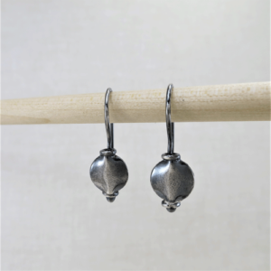 Silver Eclipse Drop Earrings: Oxidized silver drops with flat round disc on argentium ear wires.