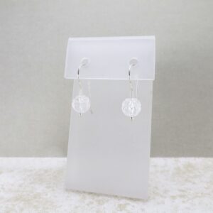 Lotus Blossom Quartz Drop Earrings: Sterling silver earrings featuring delicately carved quartz lotus flowers suspended elegantly.